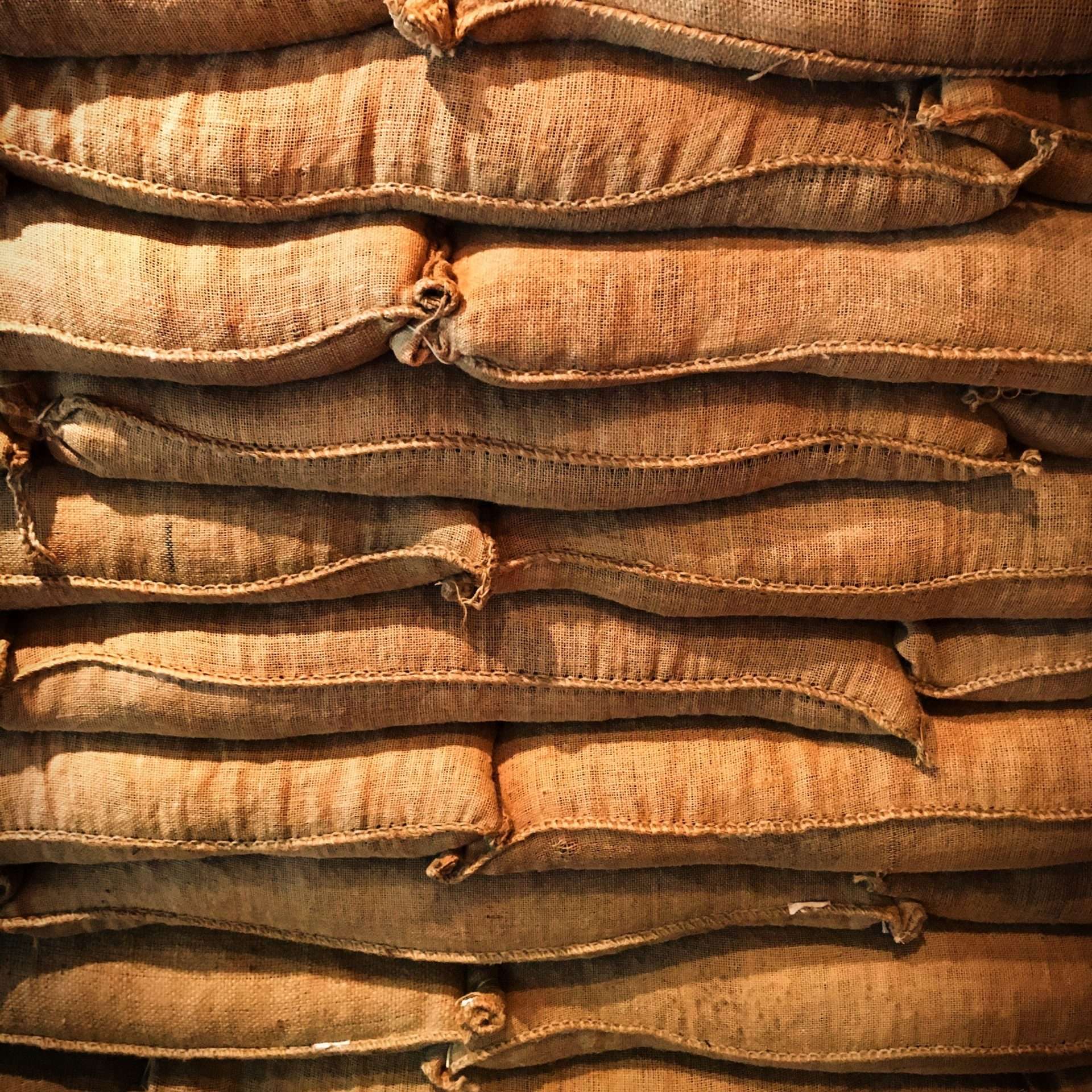 Piles of jute bags used to transport coffee.