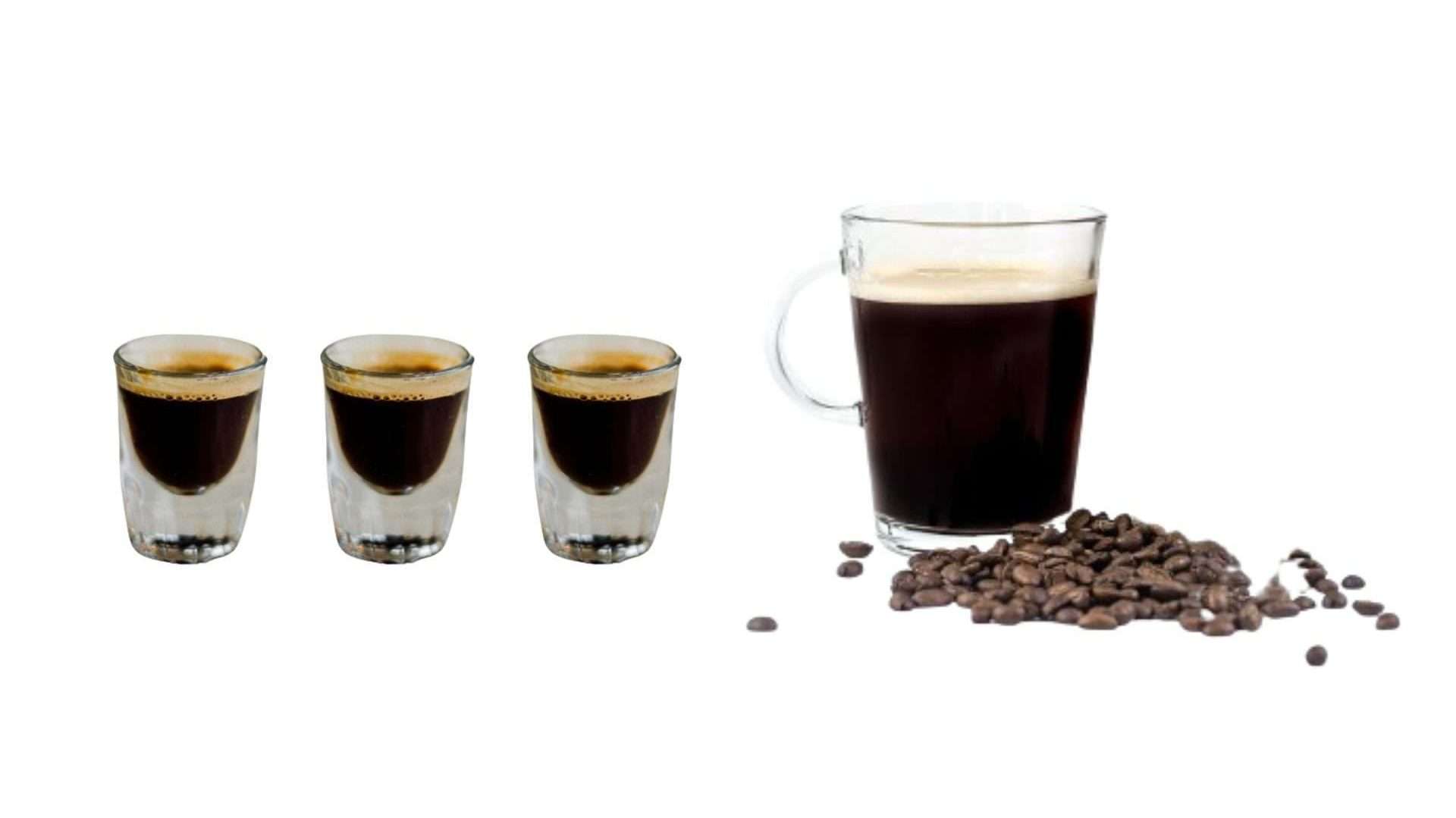 "A clear glass mug filled with dead eye coffee next to a  3 shot of espresso and a scattered pile of whole coffee beans on a white background