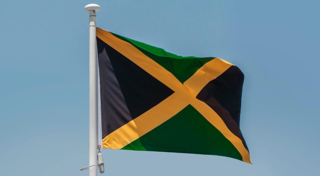 Flag of Jamaica depicted in vibrant green, yellow, and black colors.