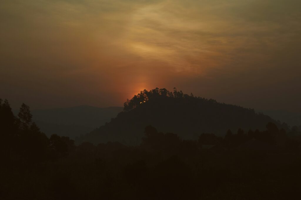 Sunrise over the lush hills of Rwanda.